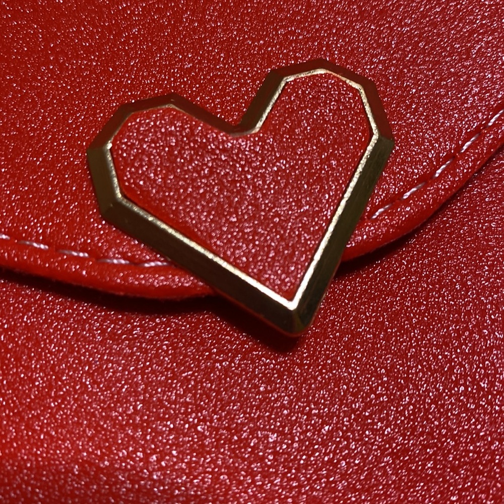 3/$15 Red faux leather crossbody with heart snap and clear back - Picture 7 of 10
